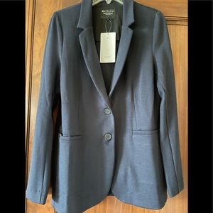 Navy blue two pocket two botton Athleta blazer with vent in back